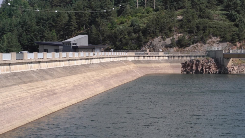 Naussac Dam on a lake With Tranquil Waters Near Langogne In Lozere, France. - static shot