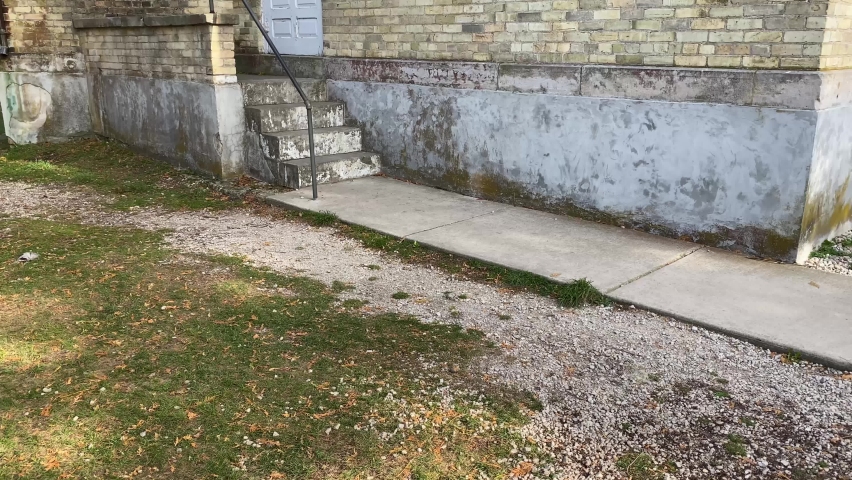 Panning shot of Eagle Bluff Lighthouse in Door County Wisconsin