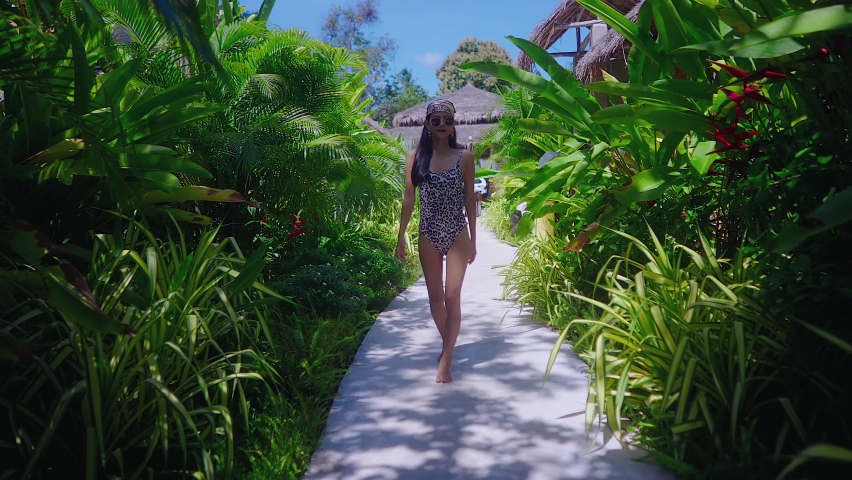 Beautiful Girl In Swimming Suit Walking Alone In Resort in Sunny Day Slow Motion