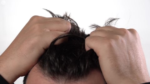 Healthy men's hair. Tousled hair on the head of a young man.
