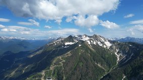 Aerial shot of Alps mountains. Mountains, peaks, cliffs, rocks, ridges, landscape, sky, clouds, nature, uncultivated nature, drone video.