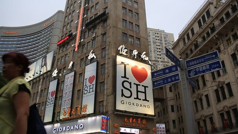  SHANGHAI, CHINA - CIRCA JUNE 2015 :  Giordano advertising sign on the shopping center wall at Shanghai Nanjing Road in Shanghai, China. 
Nanjing Road is the most famous landmark of Shanghai, China 