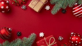 Stop motion animation with Christmas New year gift boxes, ornaments, christmas tree branches moves on red table - Powered by Shutterstock - Get 15% off with code: PIKWIZARD15