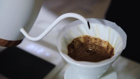 The process of brewing specialty coffee. Brewing coffee in a funnel. how to prepare a coffee filter. Work as a barista. Third wave coffee shop.