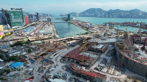 Commercial residential construction site in Kai Tak Cruise Terminal of Hong Kong city, Kwun Tong and Kowloon Bay near Victoria harbor, Aerial drone view