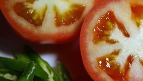 Close-up 4k video footage of tomatoes cut into round shapes
