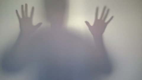 Terrifying male silhouette emerging, flashing, scary gestures. Horror film ghost behind window, monster hallucination, psycho nightmare. Frightening mysterious man shadow, devil concept, aggression 
