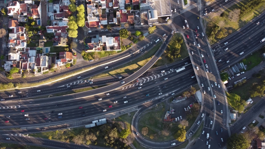 Aerial top down view of vehicular traffic on modern multilevel interstate overpass in Buenos Aires. Argentina.
