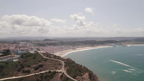 Panoramic view of Nazare beach and Atlantic ocean coast, Portugal. Charming beach resort town