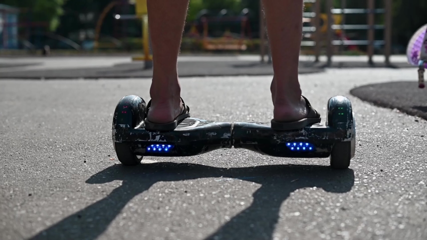 Close up of young man ready to discover the urban city at sunset with electric scooter or e-scooter