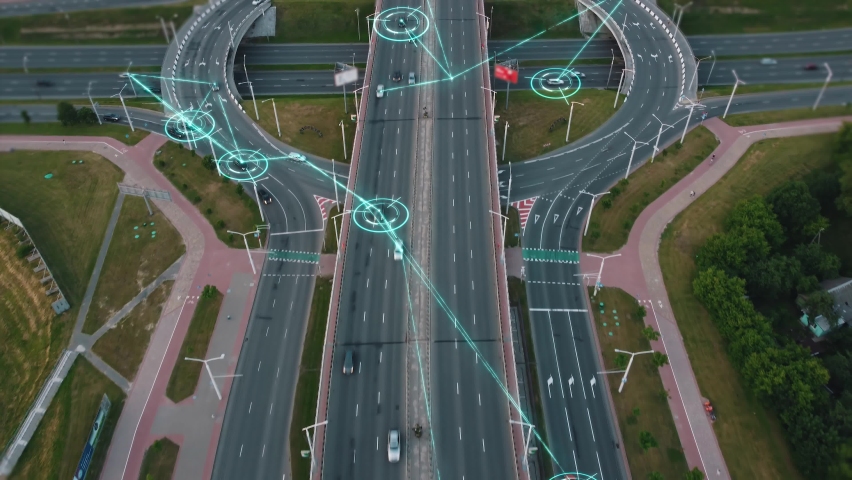 Aerial view of Self Driving Autonomous Cars with HUD-Elements on City ​​Multi-Level Highway. Futuristic Intelligent Traffic Detection System. Concept of Smart Transportation. Royalty-Free Stock Footage #1081589900