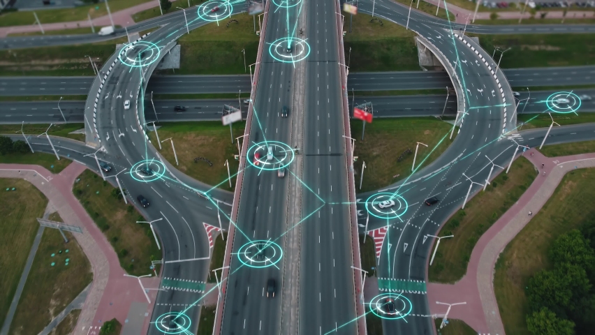 Aerial view of Self Driving Autonomous Cars with HUD-Elements on City ​​Multi-Level Highway. Futuristic Intelligent Traffic Detection System. Concept of Smart Transportation.