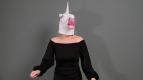 Hilarious woman in black dress and unicorn head dancing - funny weird video
