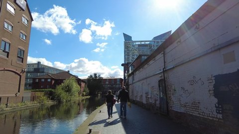 BIRMINGHAM, UK - 2021: Low street scene of Birmingham UK with people walking in the sun