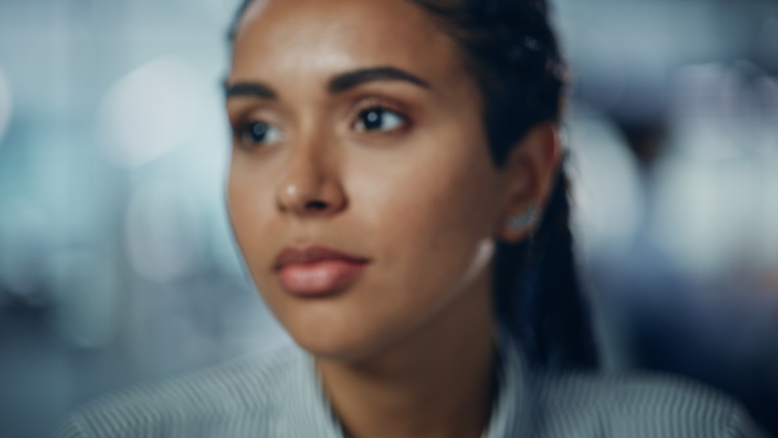Portrait of Gorgeous Black Woman with Deep Brown Eyes, Braided Hair, Perfect Smile. Beautiful Girl Turns, Looks at the Camera with Kind Dreamy Gaze. Bokeh out of Focus Background. Close-up Slow Motion | Shutterstock HD Video #1081614011