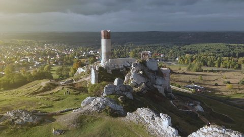 Incredible ruins of Olsztyn Castle (Silesian Voivodeship) fortification in the middle of nature in Poland at sunset, situated on the route of eagles' nests. Jura Park, gothic architecture. Aerial 4k