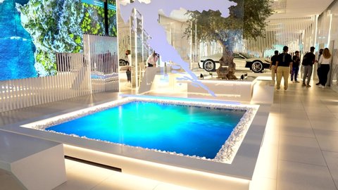 "10.22.2021 - Dubai, UAE - Croatia Pavilion indoors with map and electric car. 