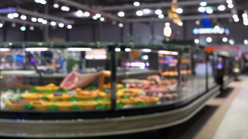 Blurred background of meat shop and people in the supermarket. Royalty-Free Stock Footage #1081632056