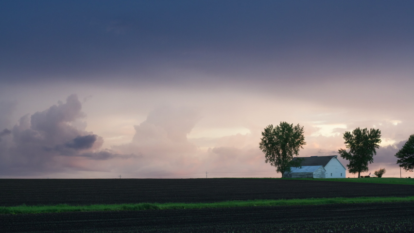 Early summer farmland and barn time lapse
