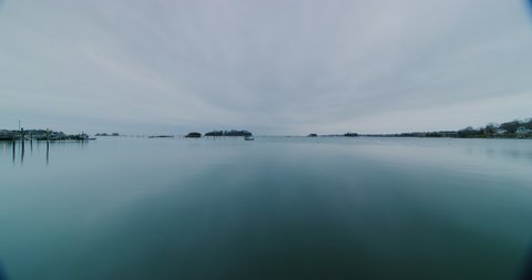 Time lapse of a cloudy day at Stony Creek neighborhood during winter time in Branford, Connecticut. Filmed with a Red Helium-8K resolution-vintage Zeiss lenses.