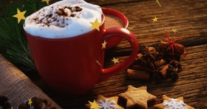 Animation of holly text over cup of coffee. christmas, tradition and celebration concept digitally generated video.