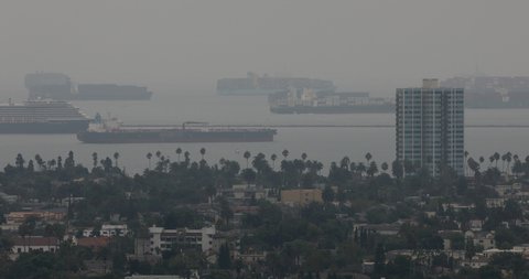 Cargo vessels anchor off the California coast.