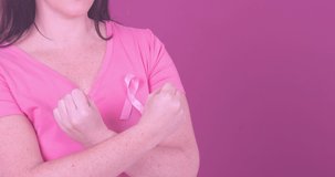 Animation of breast cancer awareness text over caucasian woman. breast cancer positive awareness campaign concept digitally generated video.