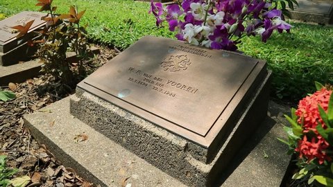 Kanchanaburi , Kanchanaburi , Thailand - 06 02 2021: Gravestone of Prisoner of War in Kanchanaburi, Thailand.