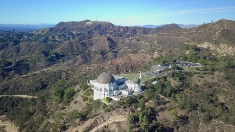  Los Angeles , United States - 10 10 2021: Aerial view around the Griffith Observatory, in Hollywood hills, Los Angeles - orbit, drone shot	