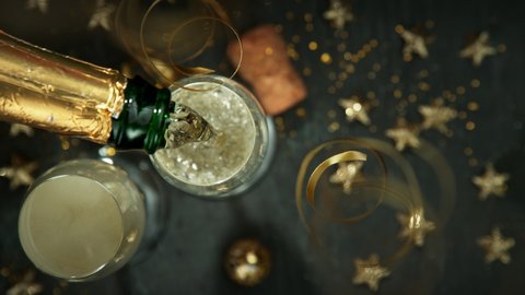 Super slow motion of pouring champagne wine into glass. Filmed on high speed cinema camera, 1000 fps