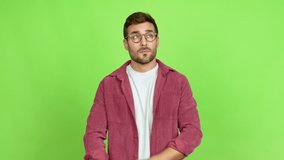 Handsome man with glasses having doubts over isolated background
