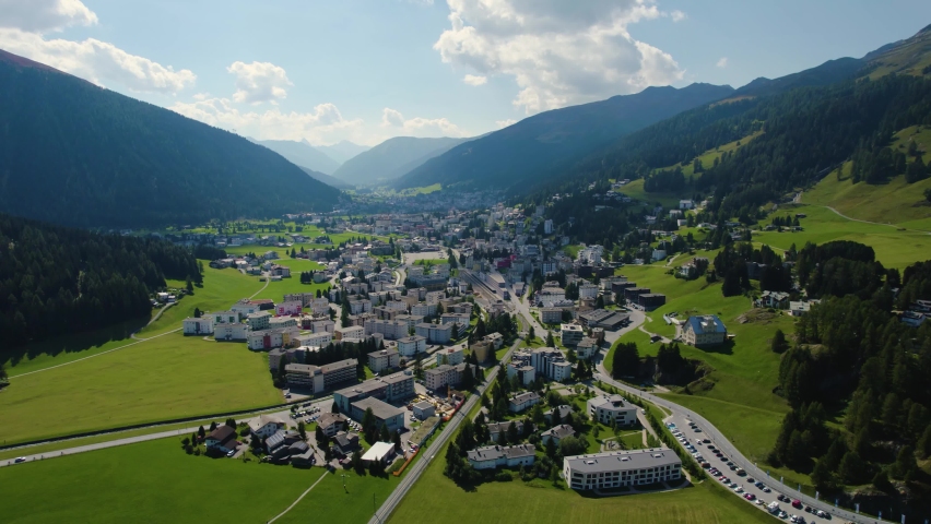 Aerial view around the city Davos in Switzerland on a sunny day in summer. | Shutterstock HD Video #1081657346