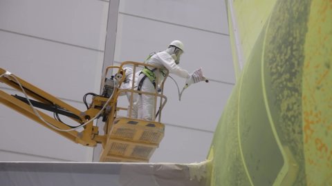 painting the aircraft in the hangar