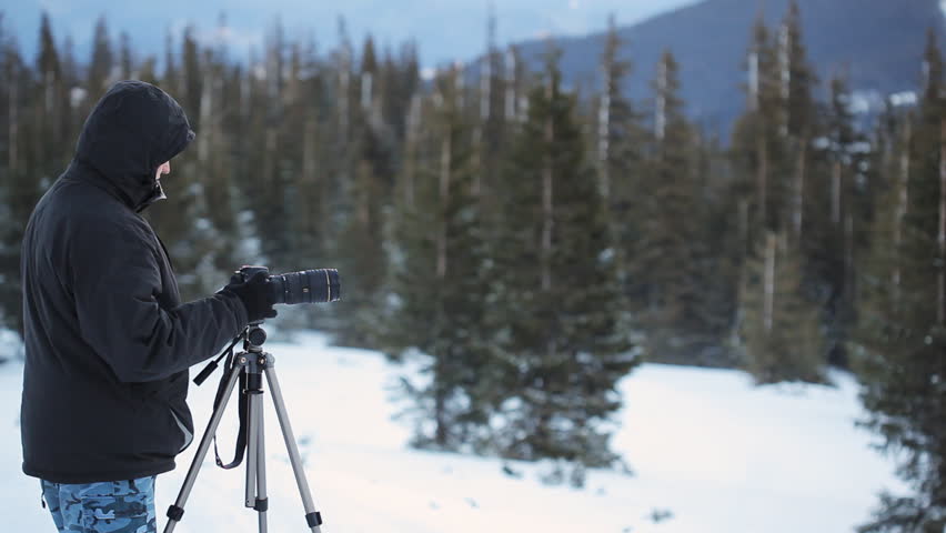 photographer in snowy landscape