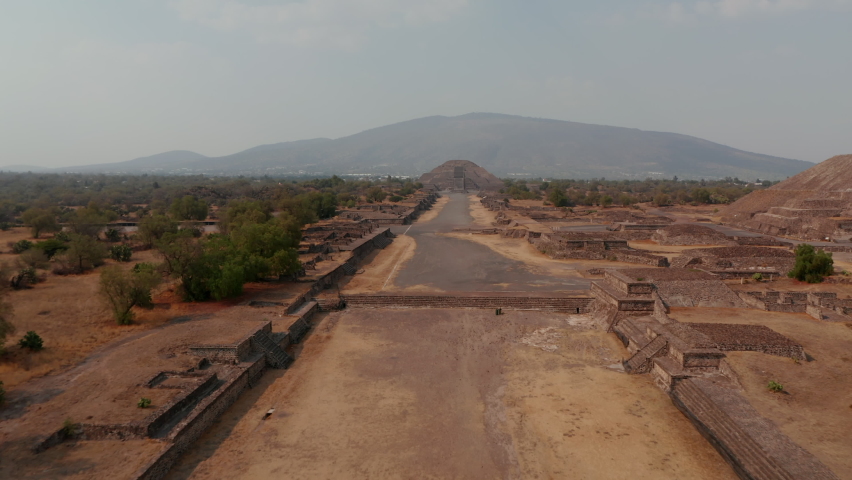 Low flight above archaeological site without people, heading to Pyramid of the moon.Ancient site with architecturally significant Mesoamerican pyramids, Teotihuacan, Mexico
