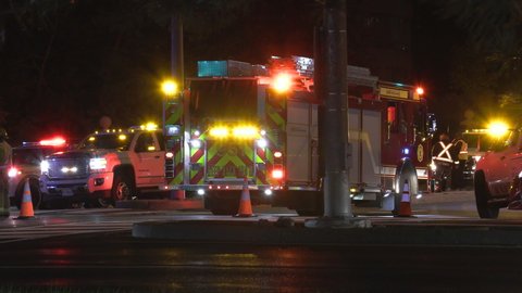 Markham, Ontario, Canada October 2021 Car accident and crash scene at night in city intersection with emergency vehicles and tow trucks