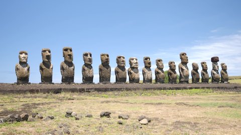 Moai statues Ahu Tongariki on Easter Island, Chile. Statues of Easter Island in Chile. Mysterious Giant megalith Moai statues. Stunning shot of mysterious monoliths on a perfect sunny day.
