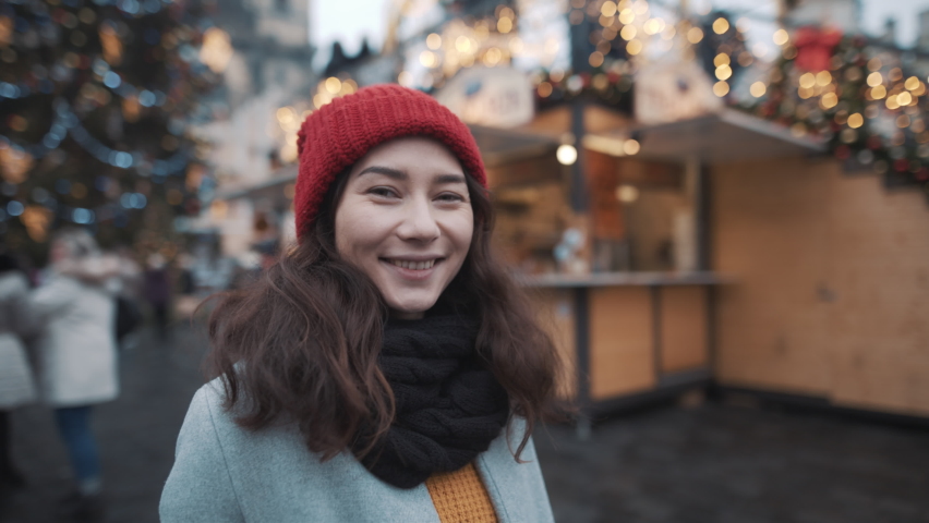 Pretty asian woman at xmas market in Prague. Filmed on RED camera, 10 bit clolor