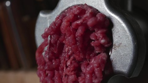 Preparation Of Minced Meat From Fresh Beef And Fresh Pork Through A Meat Grinder. Close Up. Macro.
