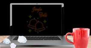 Animation of jingle bells text on laptop over fir trees on black background at christmas. christmas, winter, tradition and celebration concept digitally generated video.
