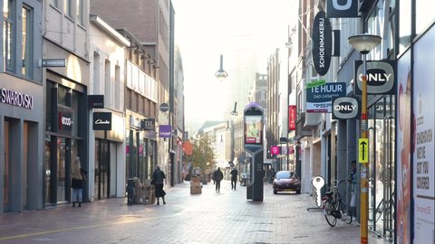 Eindhoven, The Netherlands, October 29 2021. People shopping in the city centre street with all the shops and stores on a sunny morning during fall