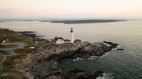 Stunning oscillating aerial shot of the Portland Headlight Lighthouse in Portland, Maine