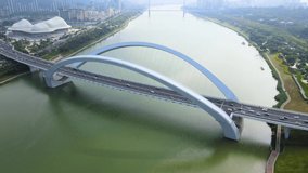 Aerial view of landmark Nanning Bridge with cars and vehicles and sea 4k Video
