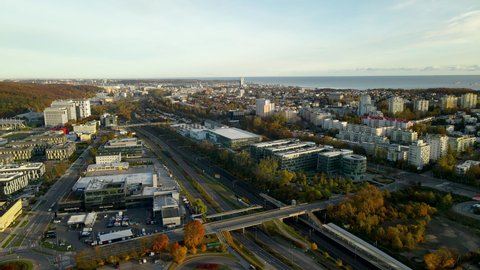 Autumn Gdynia city skyline with Pomeranian Science and Technology Park Gdynia buildings at sunrise, Baltic sea background 