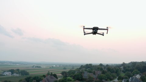 Lititz , PA , United States - 09 13 2021: Close-up aerial of drone flying in mid-air. Unmanned aerial vehicle, DJI Mavic 2 Pro. Camera videography, photography theme.