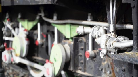 Shock Absorbers, Wheels and Hydraulic pipes of an old Locomotive