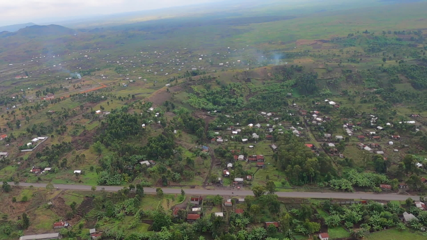 Villages dot green landscape on flight west of DRC city of Goma Africa Royalty-Free Stock Footage #1081713161