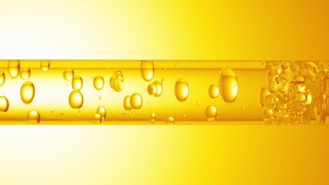 Macro shot of different sized clear bubbles flowing in glass tube with clear liquid on yellow background. Abstract body care cosmetics mixing concept