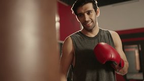 man athlete training kickboxing exercise workout punching bag tough in boxing gym enjoying fitness lifestyle,Boxing,man fighter trains his punches,training day in gym,strength fit body,strikes fast - Powered by Shutterstock - Get 15% off with code: PIKWIZARD15