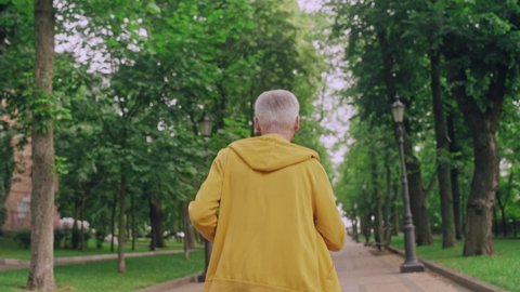Healthy senior man in sports wear running in park in the morning, lifestyle